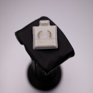 Broquel de oro 10k con zirconia en forma de media luna con zirconias
